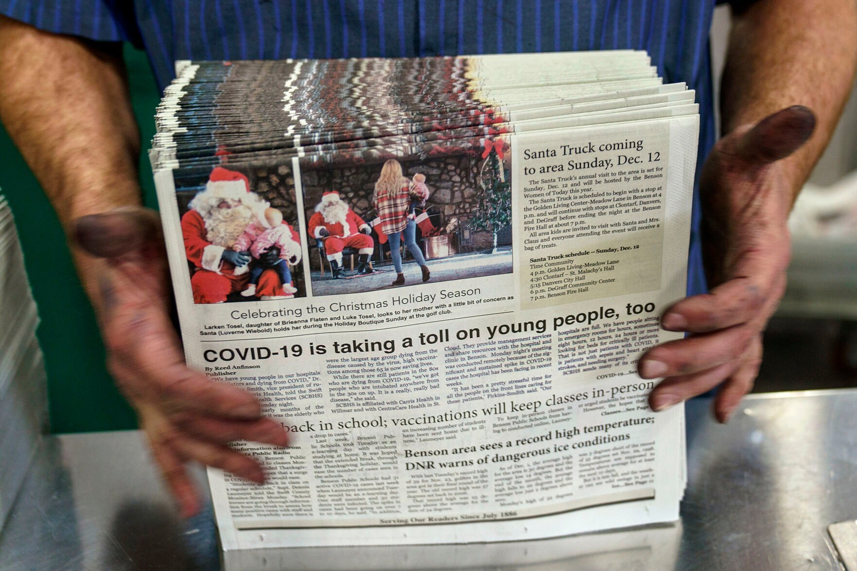 <p>Pressman Todd Grewe stacks freshly printed copies of the The Swift County Monitor-News at Quinco Press in Lowry, Minn., Tuesday, Nov. 30, 2021. Nowhere in the Monitor-News will you find reports that local people are dying because they've been inoculated. "There are no alternative facts," the paper's publisher, Reed Anfinson, says. "There is just the truth." </p>