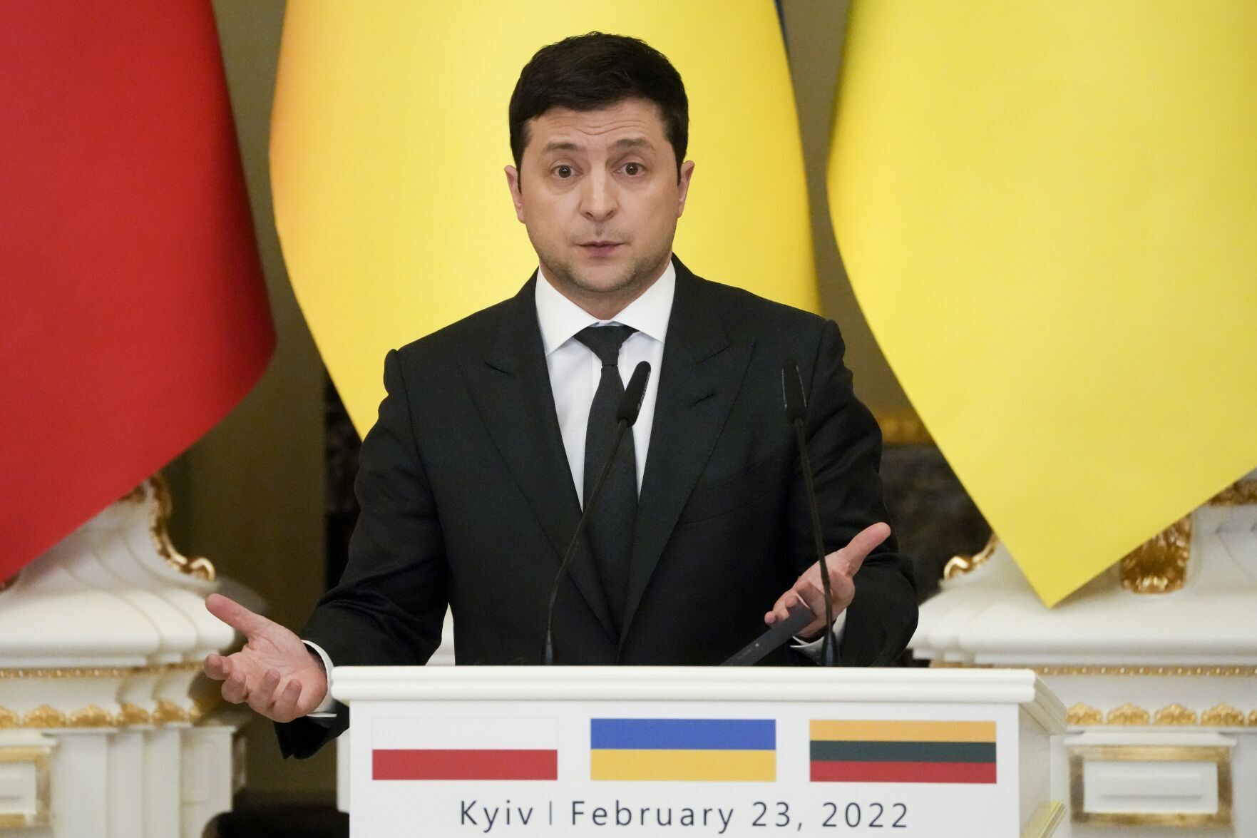 <p>Ukrainian President Volodymyr Zelenskyy gestures while speaking during a joint news conference with Polish President Andrzej Duda and Lithuania's President Gitanas Nauseda following their talks at The Mariinskyi Palace in Kyiv, Ukraine, Wednesday, Feb. 23, 2022. (AP Photo/Efrem Lukatsky)</p>
