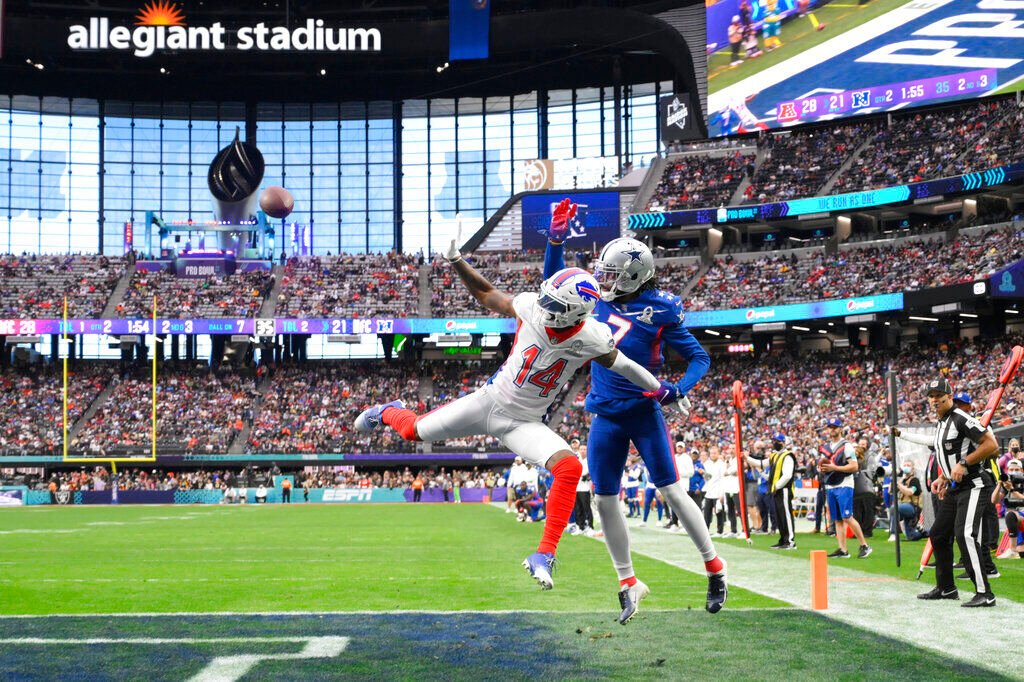 <p>AFC wide receiver Stefon Diggs (14), of the Buffalo Bills, and NFC cornerback Trevon Diggs (7), of the Dallas Cowboys, leap during an incomplete pass during the second half of the Pro Bowl NFL football game at Allegiant Stadium, Sunday, Feb. 6, 2022, in Las Vegas. (AP Photo/David Becker)</p>
