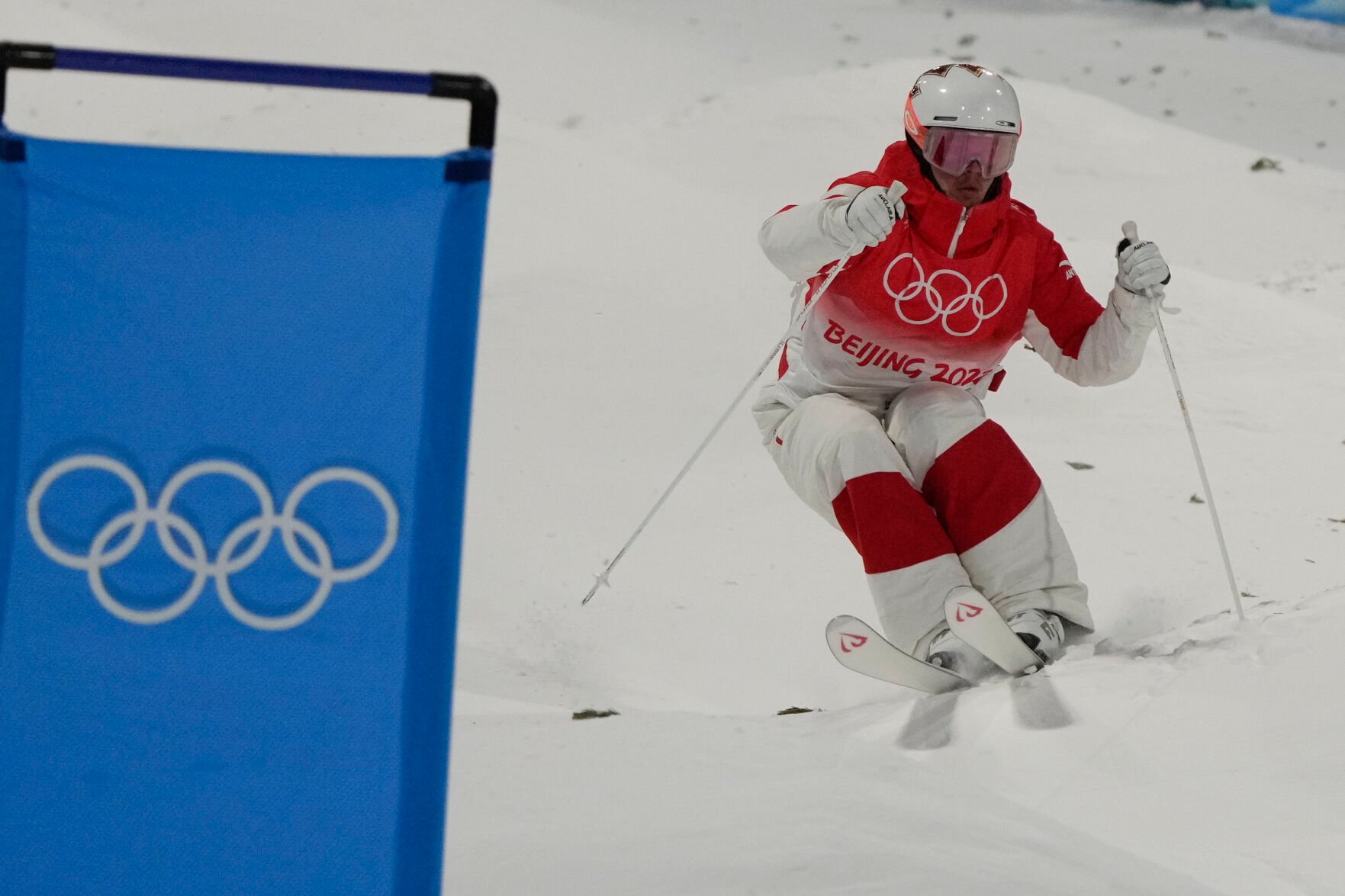 <p>Canada's Mikael Kingsbury competes in the men's moguls qualifying at Genting Snow Park at the 2022 Winter Olympics, Thursday, Feb. 3, 2022, in Zhangjiakou, China. </p>