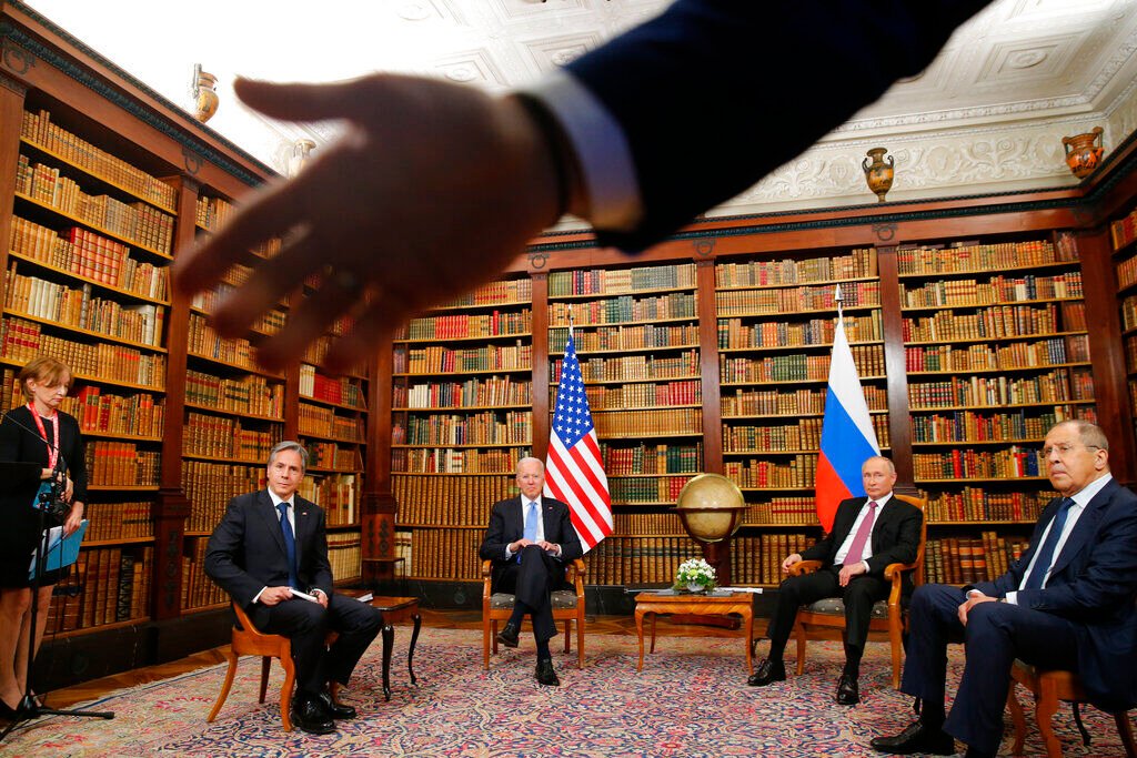 <p>FILE - A security officer indicates to the media to step back as U.S. President Joe Biden, second from left, U.S. Secretary of State Antony Blinken, left, Russia's President Vladimir Putin, second from right, and Russia's Foreign Minister Sergei Lavrov, right, meet for the U.S.-Russia summit at Villa La Grange in Geneva, Switzerland, June 16, 2021. </p>