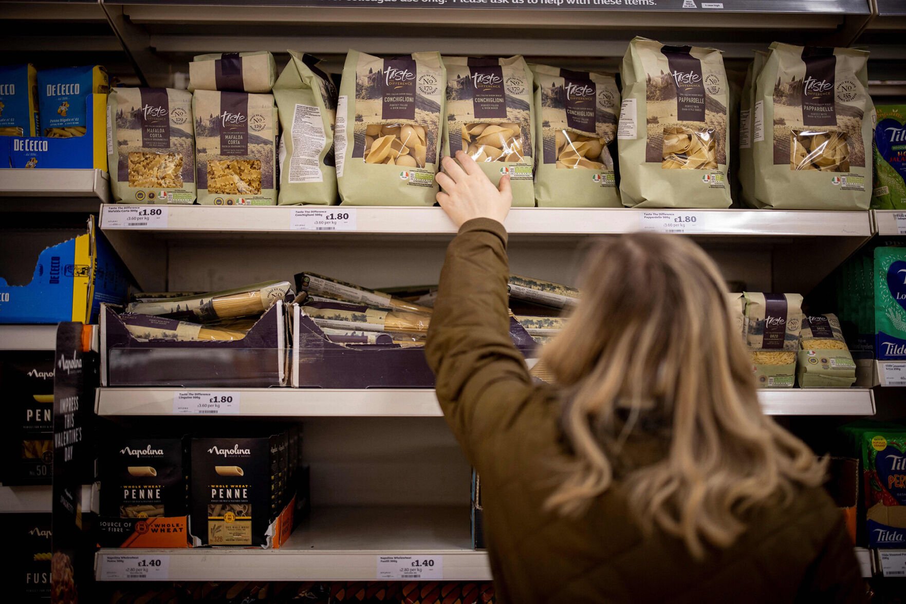 <p>A customer shops for pasta at a Sainsbury's supermarket in Walthamstow, east London, on Feb. 13, 2022. Russian President Vladimir Putin's decision to invade Ukraine could drive prices even higher at a moment when inflation is already rising at the fastest clip in decades.</p>
