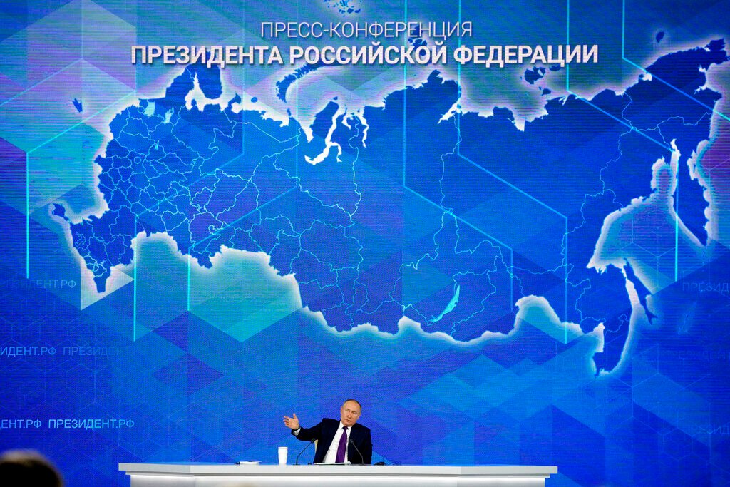 <p>FILE - Russian President Vladimir Putin speaks during his annual news conference in Moscow, Russia, Dec. 23, 2021. </p>