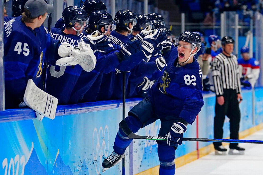 <p>Finland's Harri Pesonen (82) celebrates after scoring a goal against Slovakia during a men's semifinal hockey game at the 2022 Winter Olympics, Friday, Feb. 18, 2022, in Beijing. Finland won 2-0. </p>