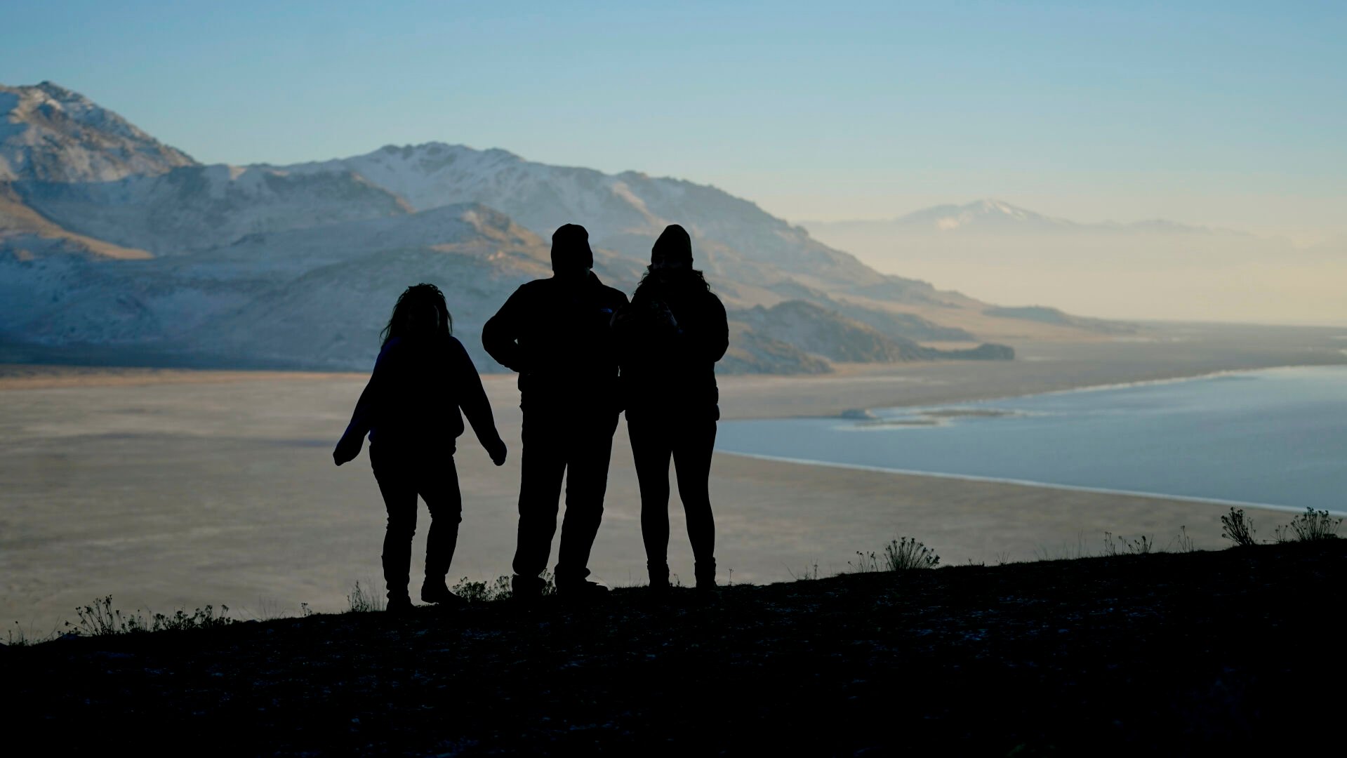 <p>Antelope Island State Park visitors view a dry lake bed at the receding edge of the Great Salt Lake Friday, Jan. 28, 2022, at Antelope Island, Utah. </p>