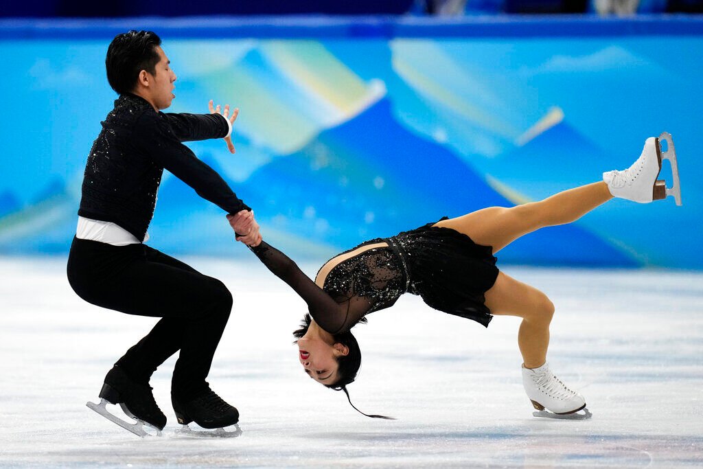 <p>Sui Wenjing and Han Cong, of China, compete in the pairs short program during the figure skating competition at the 2022 Winter Olympics, Friday, Feb. 18, 2022, in Beijing. </p>