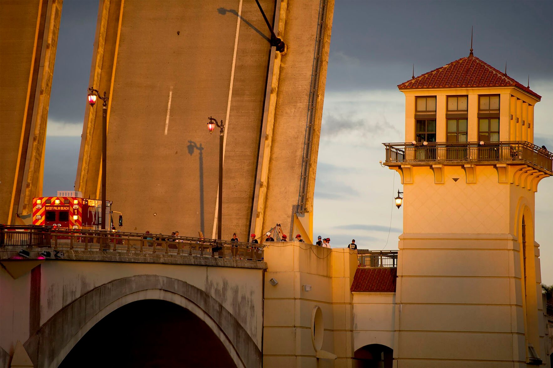 <p>The Royal Park Bridge is closed to all traffic Sunday, Feb. 6, 2022, as West Palm Beach police and fire rescue work on the scene in West Palm Beach, Fla. A bicyclist fell to her death when a drawbridge connecting Palm Beach to the Florida mainland began rising before she could reach the other side. (Meghan McCarthy/The Palm Beach Post via AP)</p>
