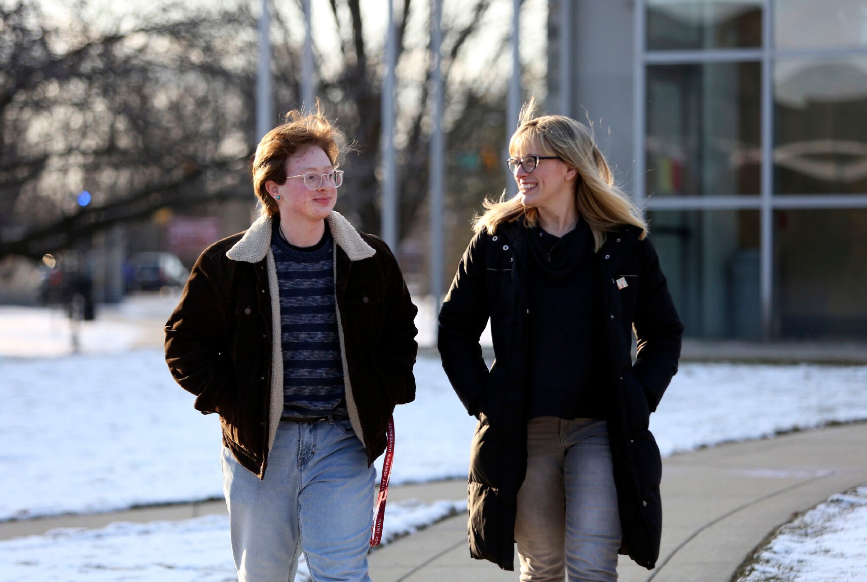 <p>Eli Musselman, left, and his mother, JoEllen Musselman, walk through the campus at St. Joseph's University in Philadelphia on Monday, Feb. 14, 2022. </p>