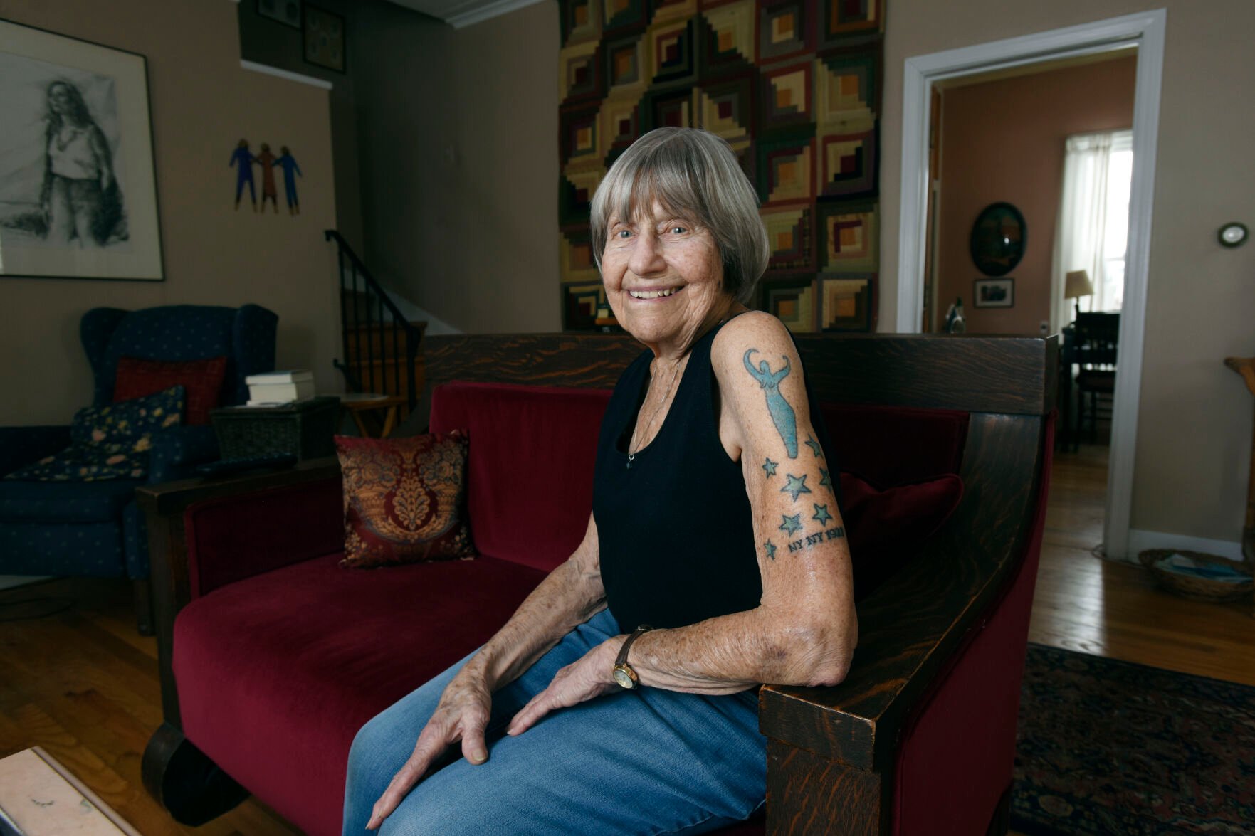 <p>Gloria Weberg shows off a new tattoo on Feb. 3, 2022, at her home in St. Joseph, Mich., that the had added recently to celebrate her 100th birthday. The "NY NY 1922" joins stars symbolizing her seven children as well as a goddess tattoo representing Mother Earth. (Don Campbell/The Herald-Palladium via AP)</p>