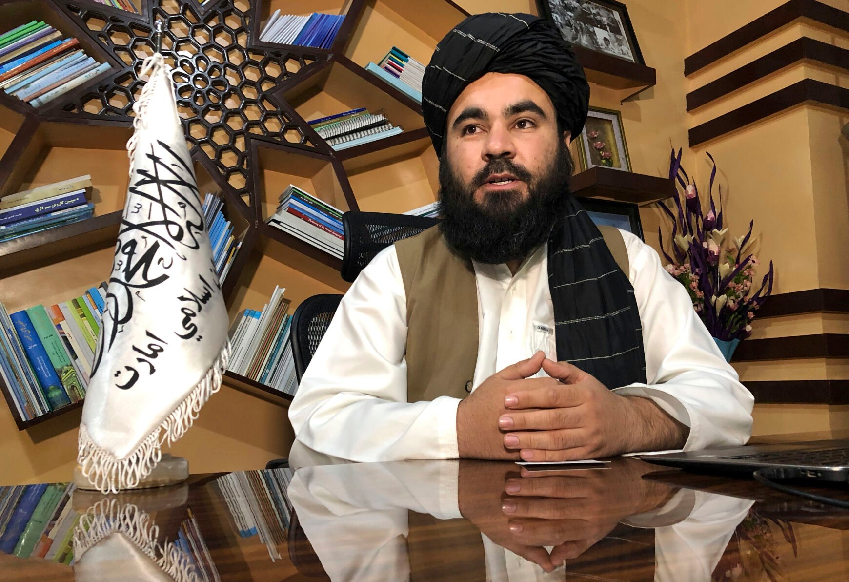 <p>Education Ministry spokesman Mawlvi Aziz Ahmad Rayan speaks during an interview with The Associated Press in Kabul, Afghanistan, Wednesday, March 23, 2022. Afghanistan's Taliban rulers unexpectedly decided against reopening schools Wednesday to girls above the sixth grade, reneging on a promise and opting to appease their hard-line base at the expense of further alienating the international community. (AP Photo/Mohammed Shoaib Amin)</p>