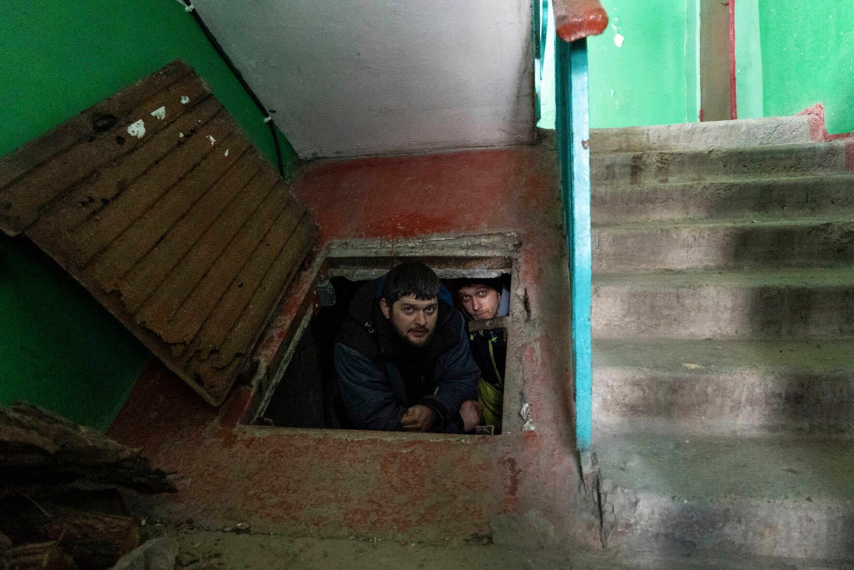 <p>People hide in an improvised bomb shelter in Mariupol, Ukraine, Saturday, March 12, 2022. </p>