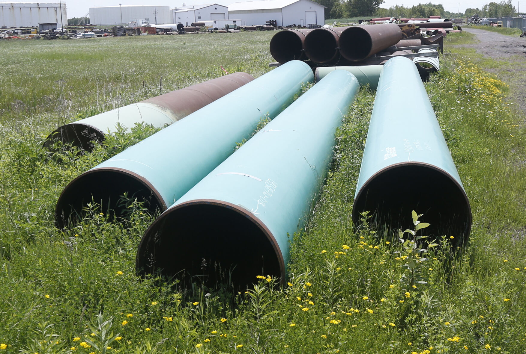 <p>FILE - In this June 29, 2018, file photo, pipeline used to carry crude oil is shown at the Superior, Wis., terminal of Enbridge Energy. The sponsor of the Keystone XL crude oil pipeline says it's pulling the plug on the contentious project, Wednesday, June 9, 2021, after Canadian officials failed to persuade the Biden administration to reverse its cancellation of the company's permit. (AP Photo/Jim Mone, File)</p>