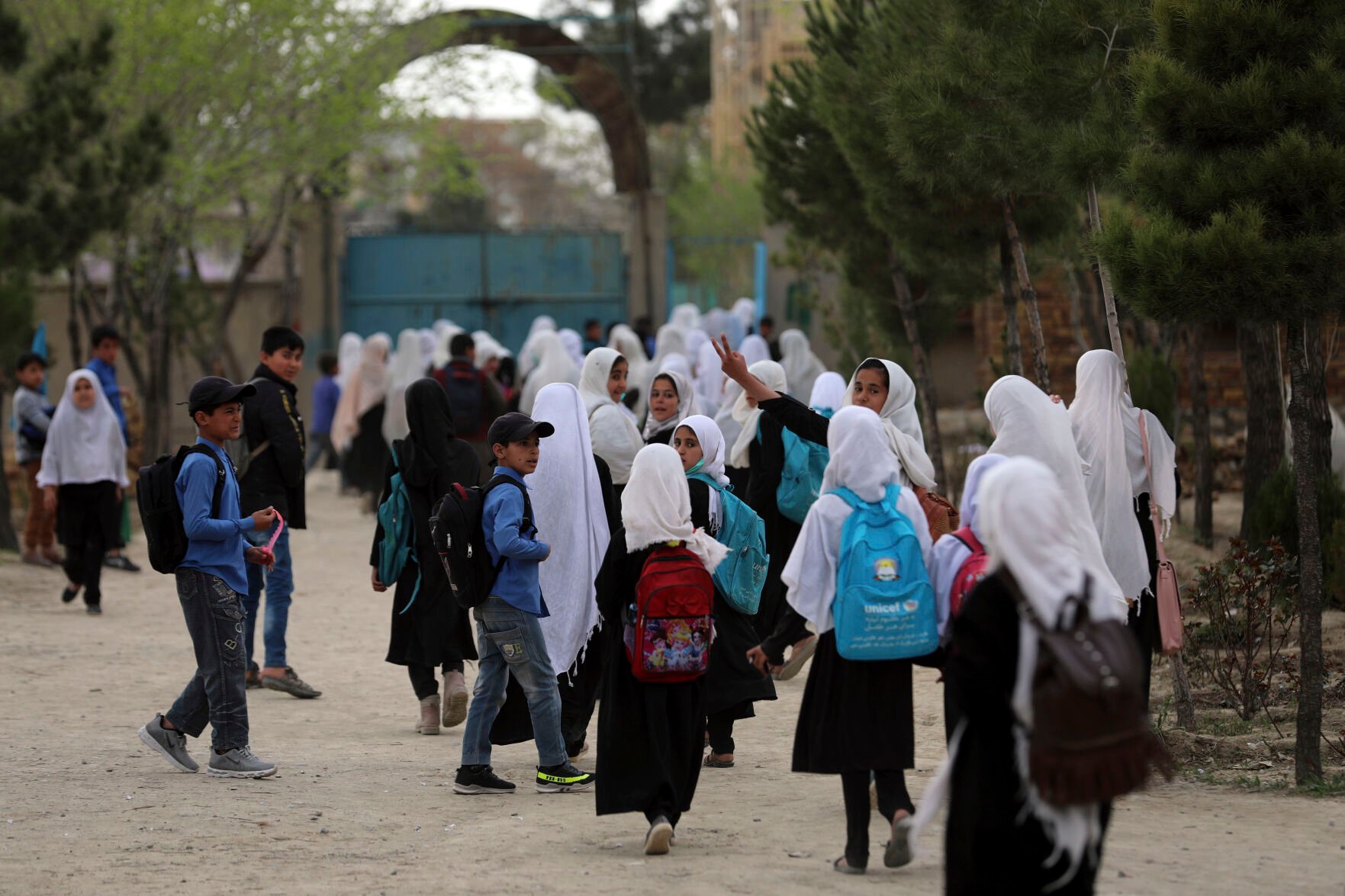 <p>FILE - Afghan students leave school classes in a primary school in Kabul, Afghanistan on March 27, 2021. In a surprise decision the hardline leadership of Afghanistan's new rulers has decided against opening educational institutions to girls beyond Grade six, a Taliban official said Wednesday, March 23, 2022 on the first day of Afghanistan's new school year. (AP Photo/Rahmat Gul, File)</p>