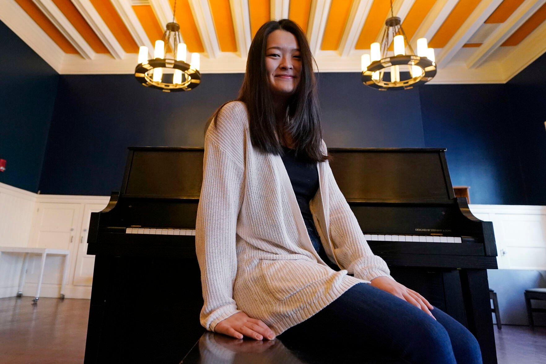<p>Julia Riew poses at Farkus Hall on the campus of Harvard University in Cambridge, Mass.</p>