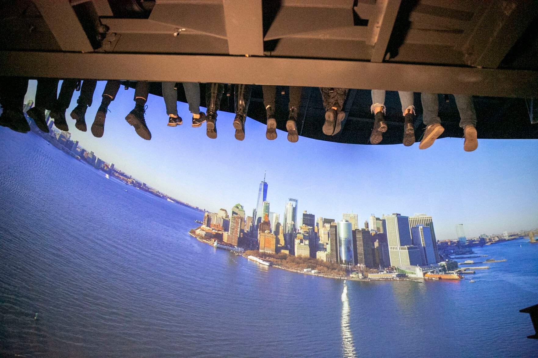 <p>People ride a new indoor tourist attraction called RiseNY just off Times Square in Manhattan's Theater District in New York City on Tuesday, March 1, 2022. </p>