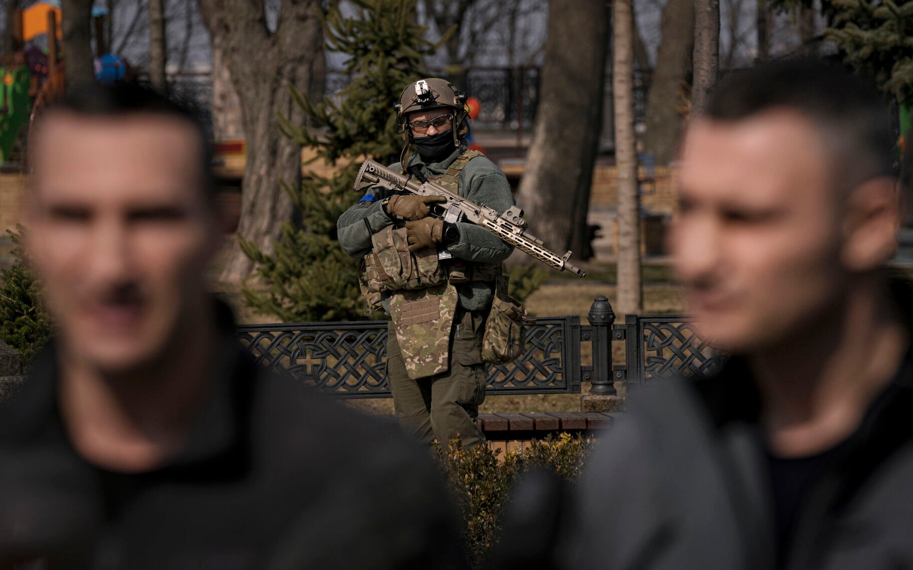 <p>A Ukrainian serviceman guards the area as Kyiv Mayor Vitali Klitschko, right, speaks during a press conference next to his brother, former heavyweight boxing world champion Wladimir Klitschko, in Kyiv, Ukraine, Wednesday, March 23, 2022. </p>