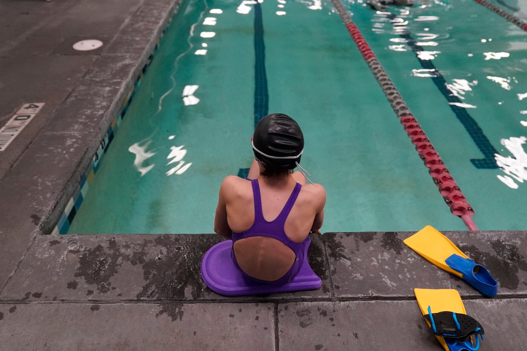 <p>FILE - A proposed ban on transgender athletes playing female school sports in Utah would affect transgender girls like this 12-year-old swimmer seen at a pool in Utah on Feb. 22, 2021. She and her family spoke with The Associated Press on the condition of anonymity to avoid outing her publicly. She cried when she heard about the proposal that would ban transgender girls from competing on girls' sports teams in public high schools, which would separate her from her friends. </p>