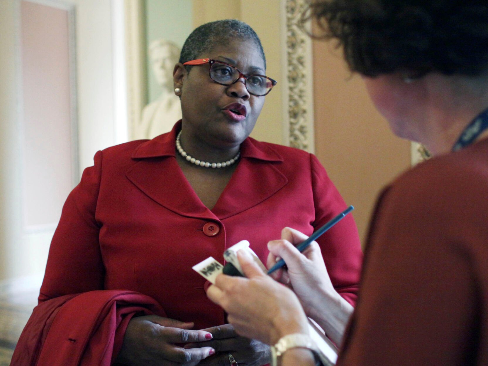 <p>FILE - Melanie Campbell, president of the National Coalition on Civic Participation, speaks to a reporter on Capitol Hill in Washington, April 15, 2015. </p>