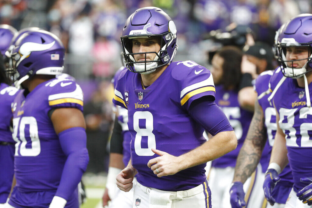 <p>FILE - Minnesota Vikings quarterback Kirk Cousins (8) runs on the field before an NFL football game against the Chicago Bears, Sunday, Jan. 9, 2022, in Minneapolis. New Minnesota Vikings general manager Kwesi Adofo-Mensah's first season with the Vikings will be a tall task given their current commitments. Kirk Cousins is currently carrying a million salary cap charge on the final year of his existing contract. (AP Photo/Bruce Kluckhohn, FIle)</p>
