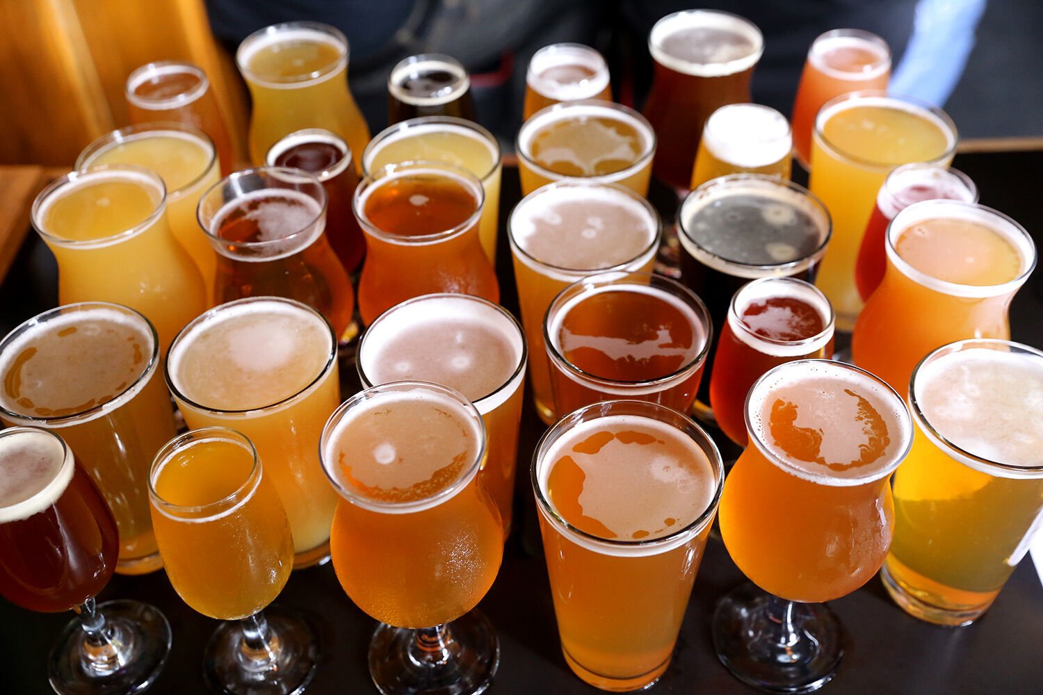 <p>Beer is fermented by yeast, which breaks down sugars into alcohols.</p>