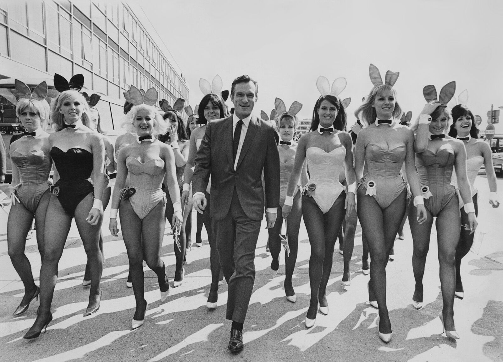 <p>Hugh Hefner arrives at London Airport from Chicago with an entourage of Playboy Bunnies on June 26, 1966, for the opening of the London Playboy Club. (Ted West/Central Press/Hulton Archive/Getty Images/TNS)</p>