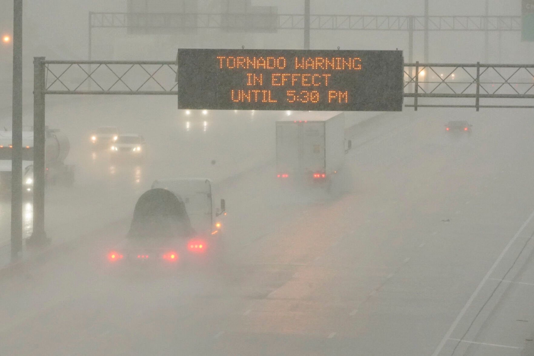 <p>The Mississippi Department of Transportation digital message board warns drivers along I-55 southbound in Jackson of a tornado warning during a rainstorm during the outbreak of severe weather in the state, Wednesday, March 30, 2022. (AP Photo/Rogelio V. Solis)</p>