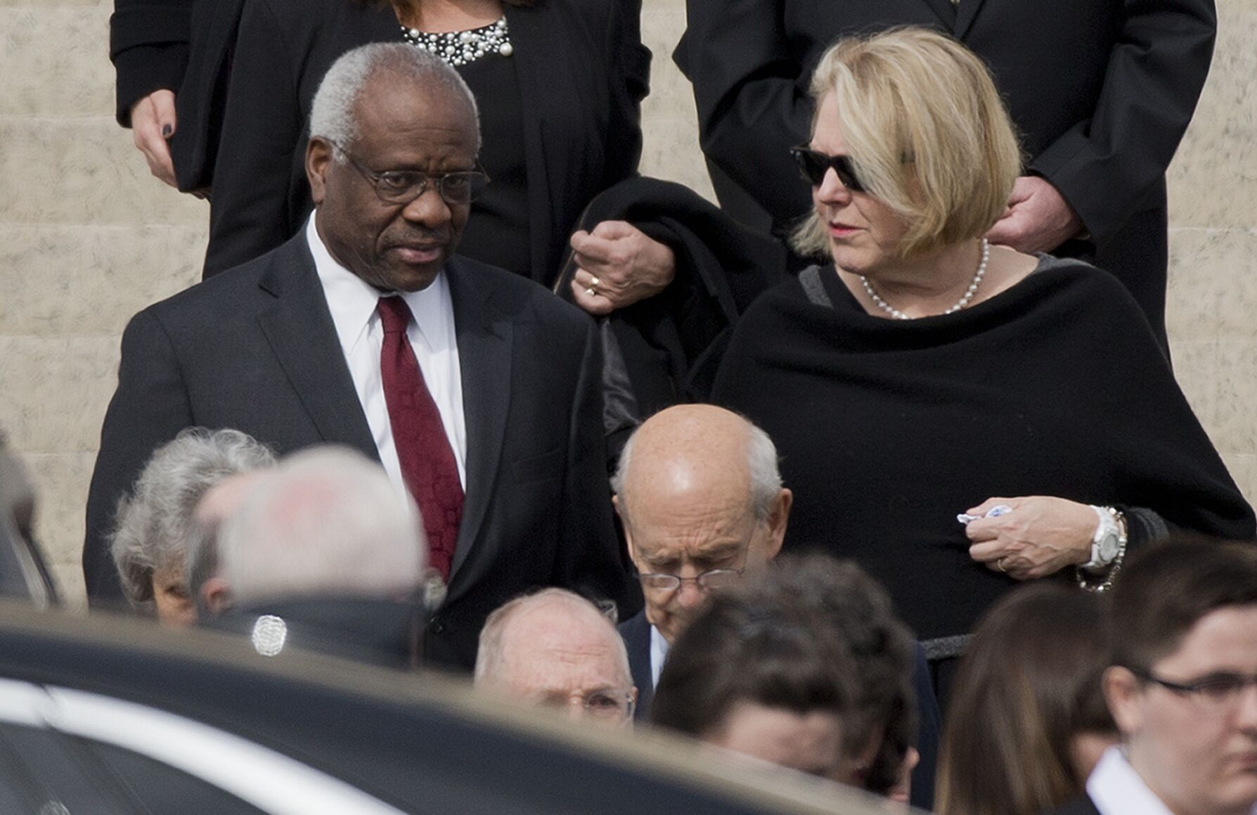 <p>FILE - Supreme Court Associate Justice Clarence Thomas, left and his wife Virginia Thomas, right, leave the the Basilica of the National Shrine of the Immaculate Conception in Washington after attending funeral services of the late Supreme Court Associate Justice Antonin Scalia, on Feb. 20, 2016. </p>