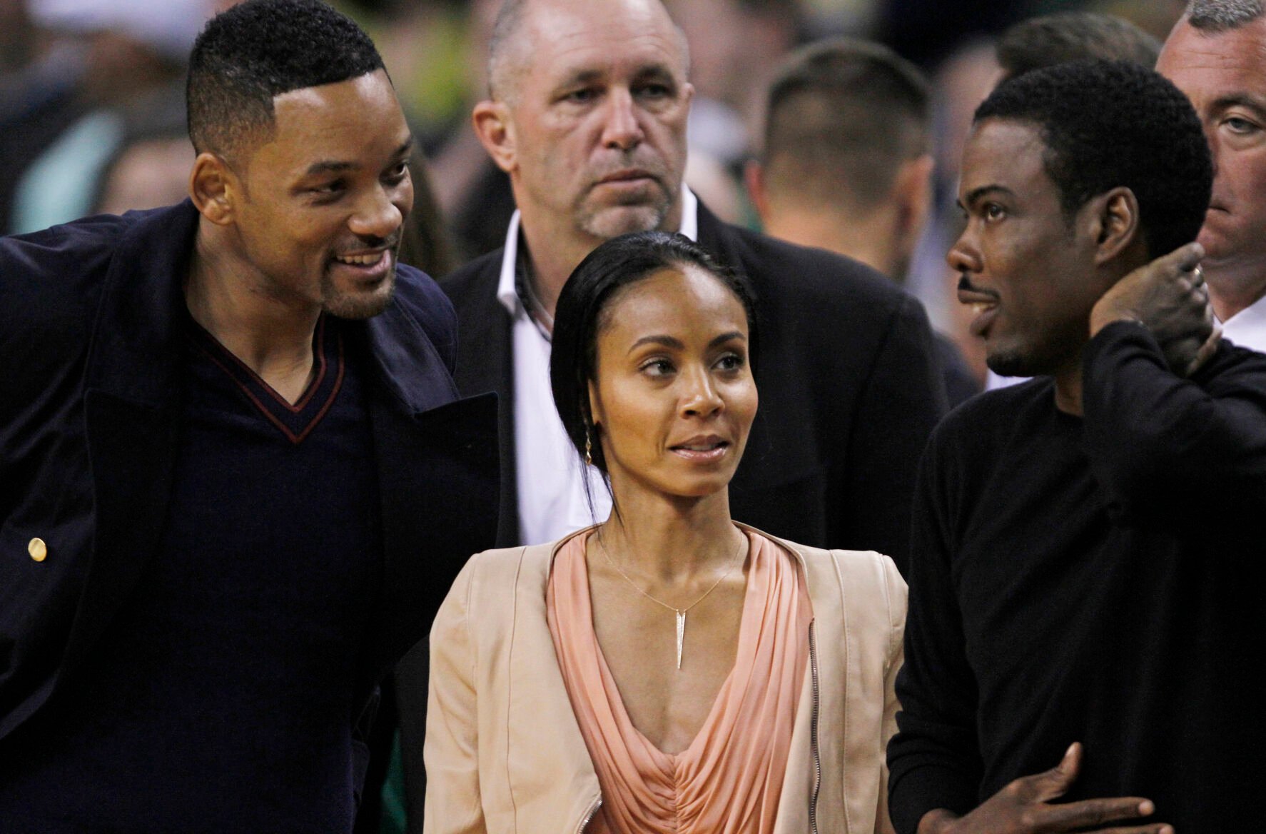 <p>Actor Will Smith, left, actress Jada Pinkett Smith, center, and actor Chris Rock during the second quarter of Game 5 in their NBA basketball Eastern Conference semifinal playoff series in Boston, Monday, May 21, 2012. </p>
