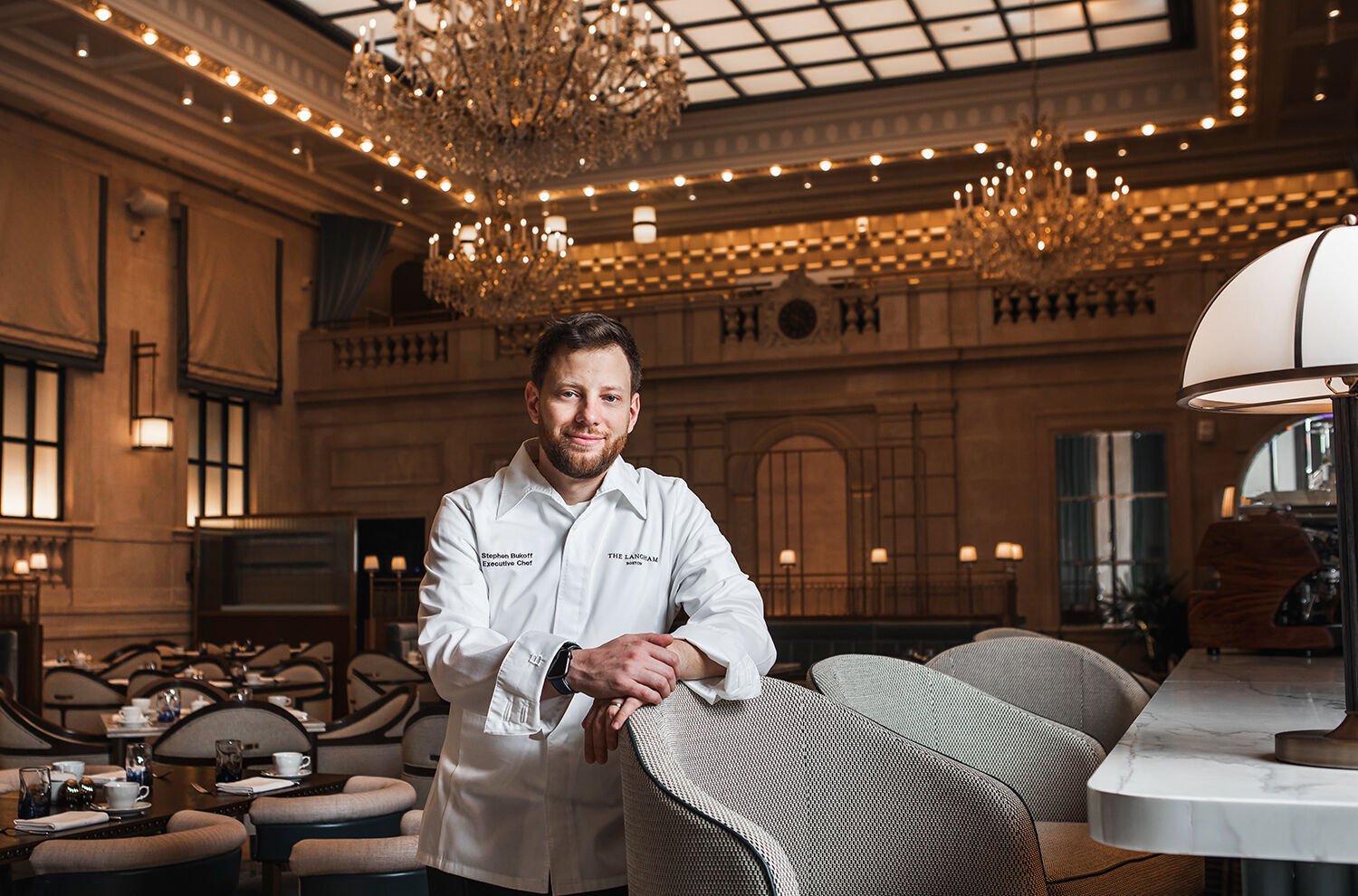 <p>Stephen Bukoff inside Grana, The Langham's <span>new signature restaurant</span> set in what was once the Grand Hall of the Federal Reserve Bank of Boston.</p>