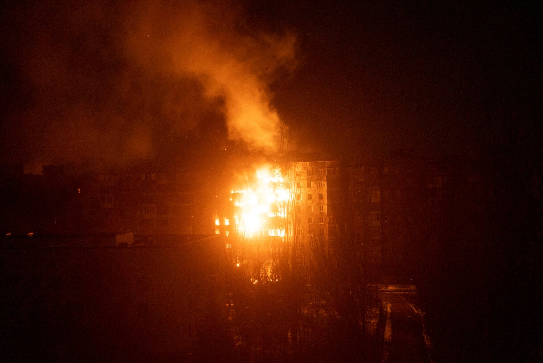 <p>A fire burns at an apartment building after it was hit by shelling in Mariupol, Ukraine, Friday, March 11, 2022. </p>