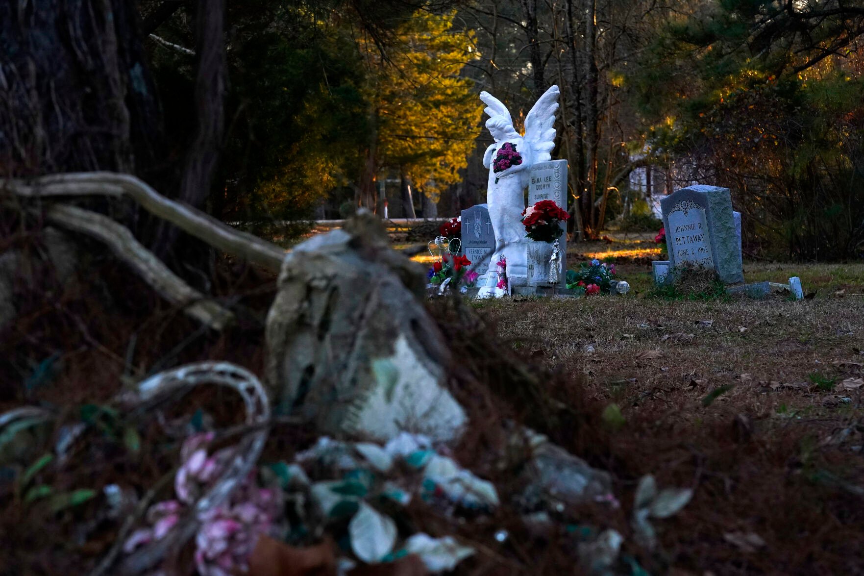 <p>The town cemetery in Princeville, N.C., is a reminder of the permanent damage to the small community Monday, Feb. 28, 2022. Strewn cinder blocks can still be seen from past flooding, where some caskets were found floating in the community. </p>