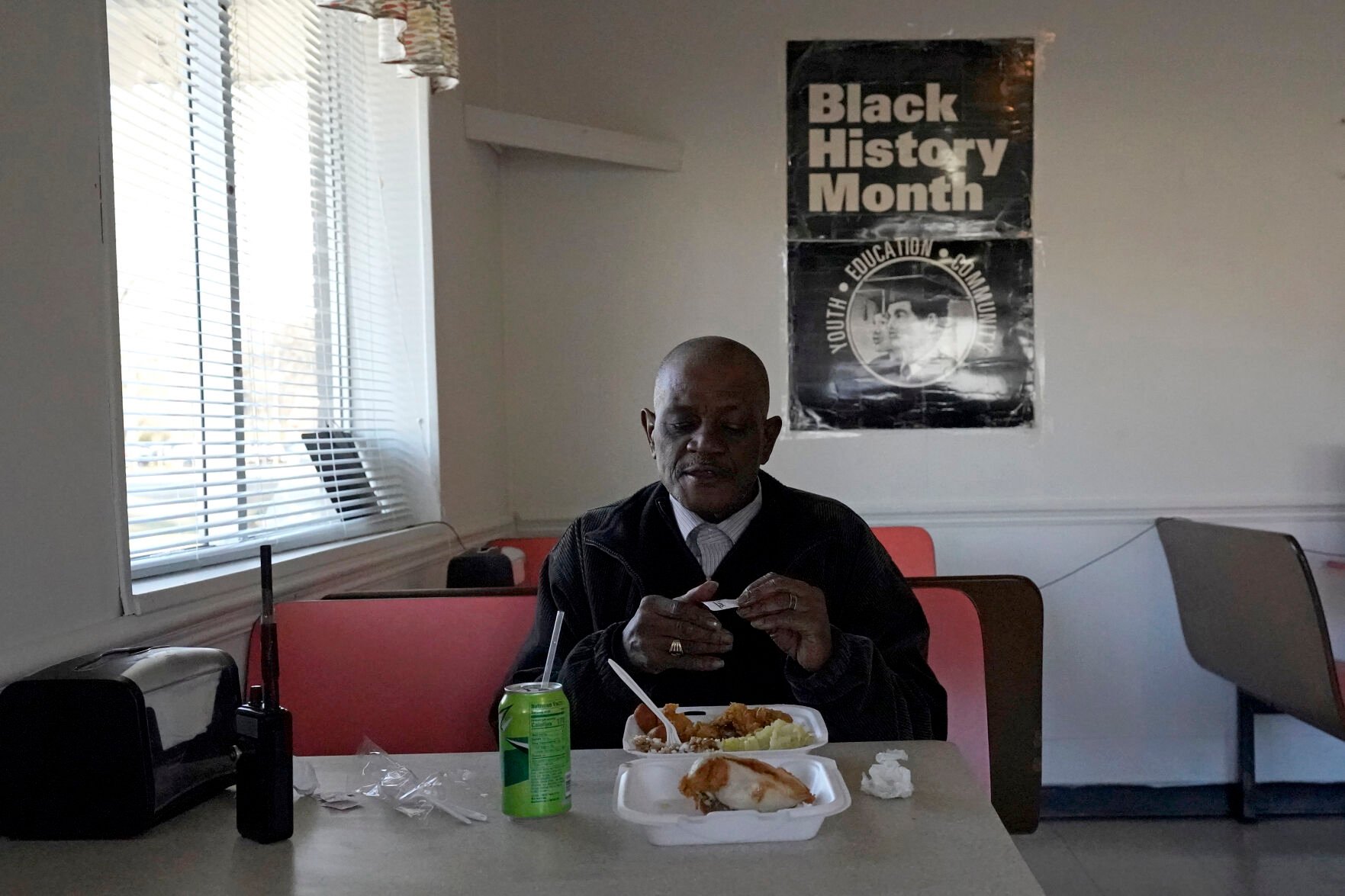 <p>Princeville resident Eddie Pettaway eats dinner at Tray-Seas Soul Food Restaurant in Princeville, N.C., Monday, Feb. 28, 2022. The restaurant is one of only a handful of establishments in the historic small town along the banks of the Tar River. </p>