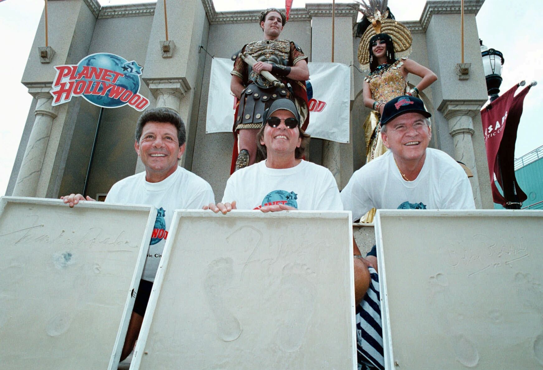 <p>FILE - Former teen idols from the 50's and 60's Frankie Avalon, left, Fabian, center, and Bobby Rydell, right, show off their foot prints in plaster casts Friday, July 3, 1998, on the Boardwalk in Atlantic City, N.J. </p>
