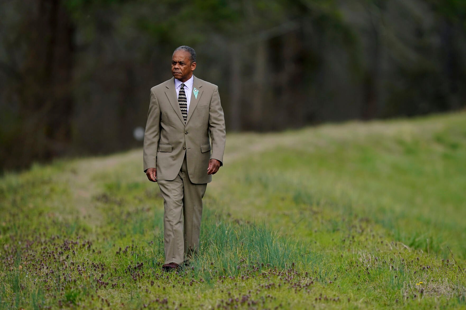 <p>Mayor Bobbie Jones looks out over the Tar River from an earthen levee in Princeville, N.C., Thursday, March 17, 2022. </p>