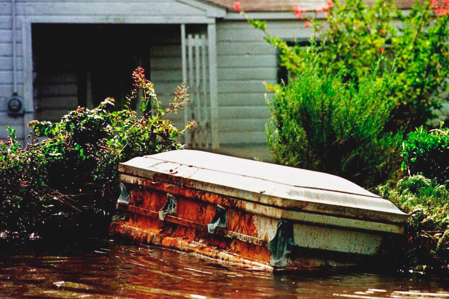 <p>FILE - A casket floats in a flooded yard in Princeville, N.C., Sept. 22, 1999, in the aftermath of Hurricane Floyd. Historic Princeville, on the banks of the Tar River in eastern North Carolina, is one hurricane away from disaster. </p>