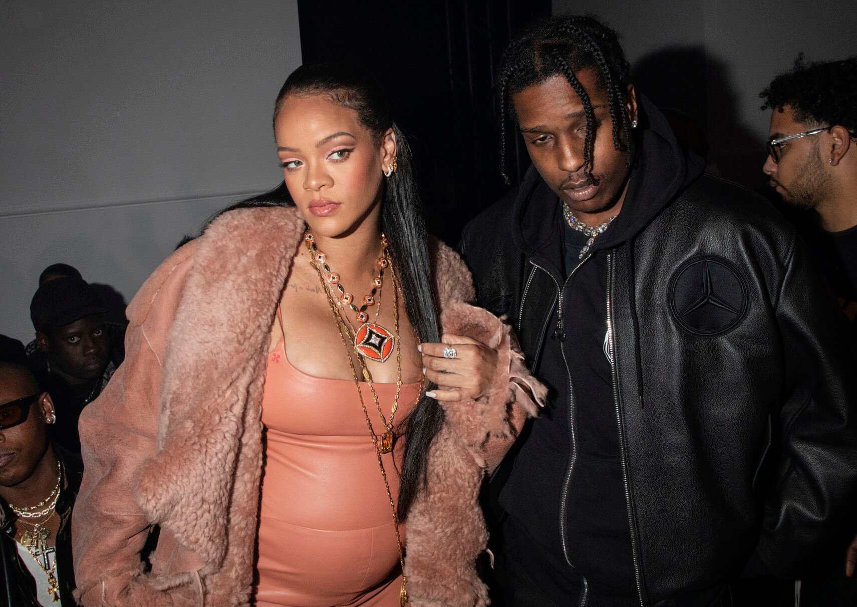 <p>FILE - Rihanna, left, and ASAP Rocky appear at the Off-White Ready To Wear Fall/Winter 2022-2023 fashion collection, in Paris on Feb. 28, 2022. Now in her third trimester, the music star, and fashion and beauty mogul hasn't exactly been hiding under a maternity tent since she and boyfriend A$AP Rocky announced they were expecting. She's made the fashion week rounds in Milan and Paris wearing a range of couture that shows off her belly. (Photo by Vianney Le Caer/Invision/AP, File)</p>