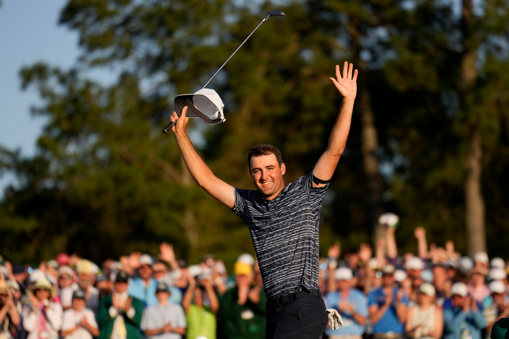 <p>Scottie Scheffler celebrates after winning the 86th Masters golf tournament on Sunday, April 10, 2022, in Augusta, Ga.</p>