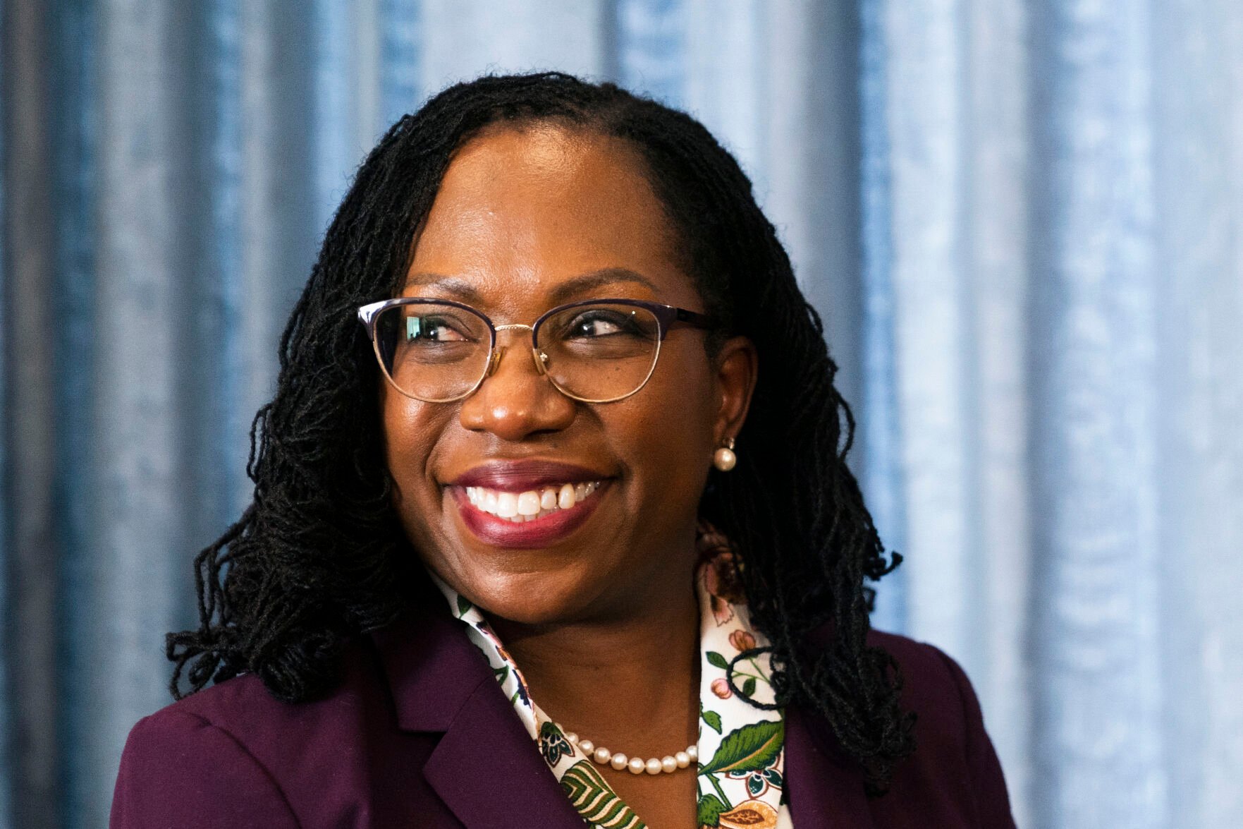 <p>Supreme Court nominee Judge Ketanji Brown Jackson glances at members of the media during her meeting with Sen Mark Warner, D-Va., on Capitol Hill, Monday, April 4, 2022, in Washington. </p>