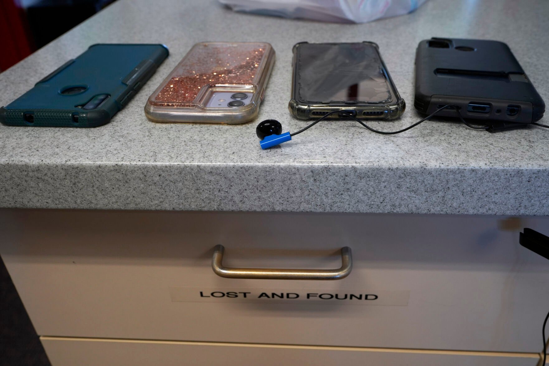 <p>Students' cell phones are collected by school administration before the start of the spring break at the "Lost and Found" at California City Middle School in California City, Calif., on Friday, March 11, 2022. </p>