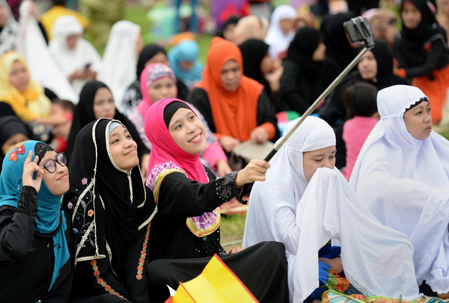 <p>Young Muslims devotees take a "selfie" prior to Friday prayers to mark the end of Ramadan last year in Manila, Philippines.</p>