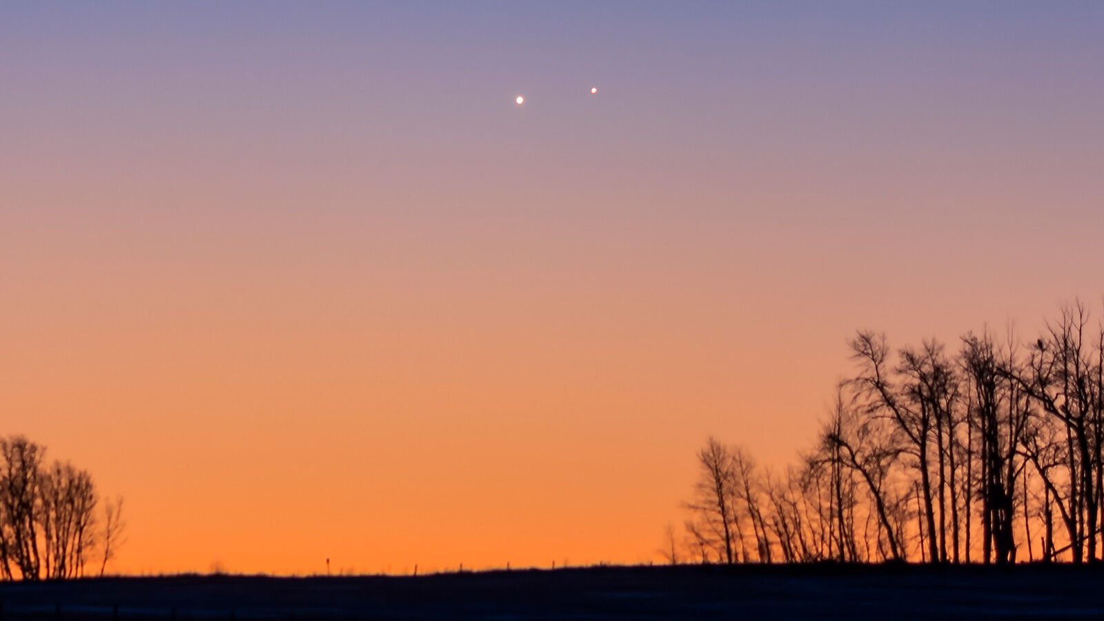 <p>Venus and Jupiter will appear to touch each other in the sky on April 30. The planets are shown here in close conjunction on Nov. 13, 2017, in Alberta, Canada.</p>