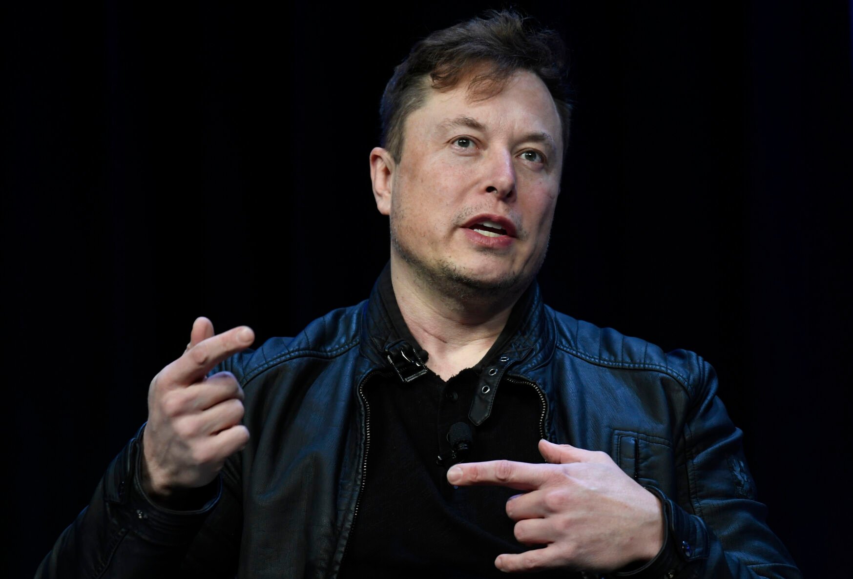 <p>FILE -Tesla and SpaceX Chief Executive Officer Elon Musk speaks at the SATELLITE Conference and Exhibition in Washington, Monday, March 9, 2020. </p>