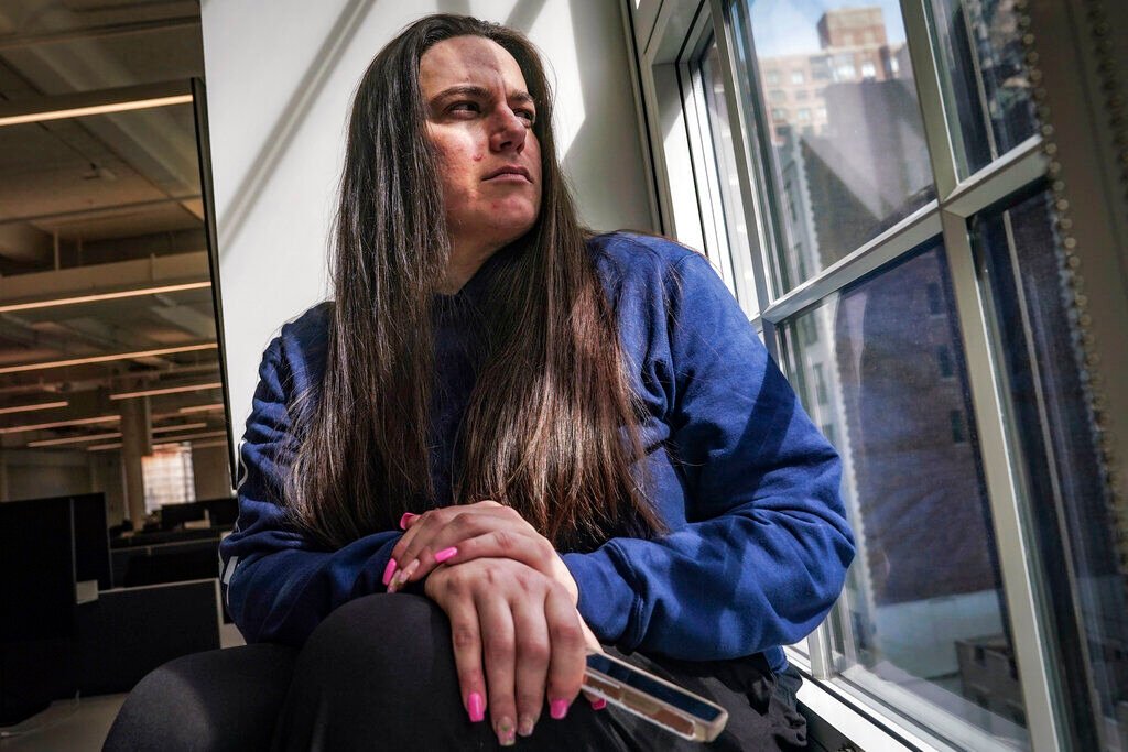 <p>Angelina Proia, who lost her father Richard Proia to COVID-19 in April 2020, poses for a photo on Wednesday, May 11, 2022, in New York. She runs a support group for grieving families on Facebook and has seen it divided over vaccinations. She has booted people from the group for spreading misinformation. </p>