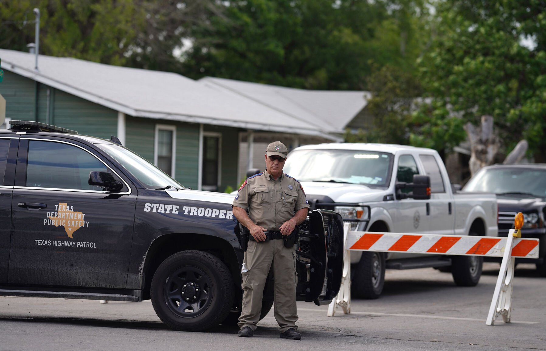 <p>A State trooper stands seen outside of Robb Elementary School in Uvalde, Texas, on Tuesday, May 24, 2022, after an 18-year-old gunman killed 14 children and a teacher at the school. (Allison Dinner/AFP/Getty Images/TNS)</p>