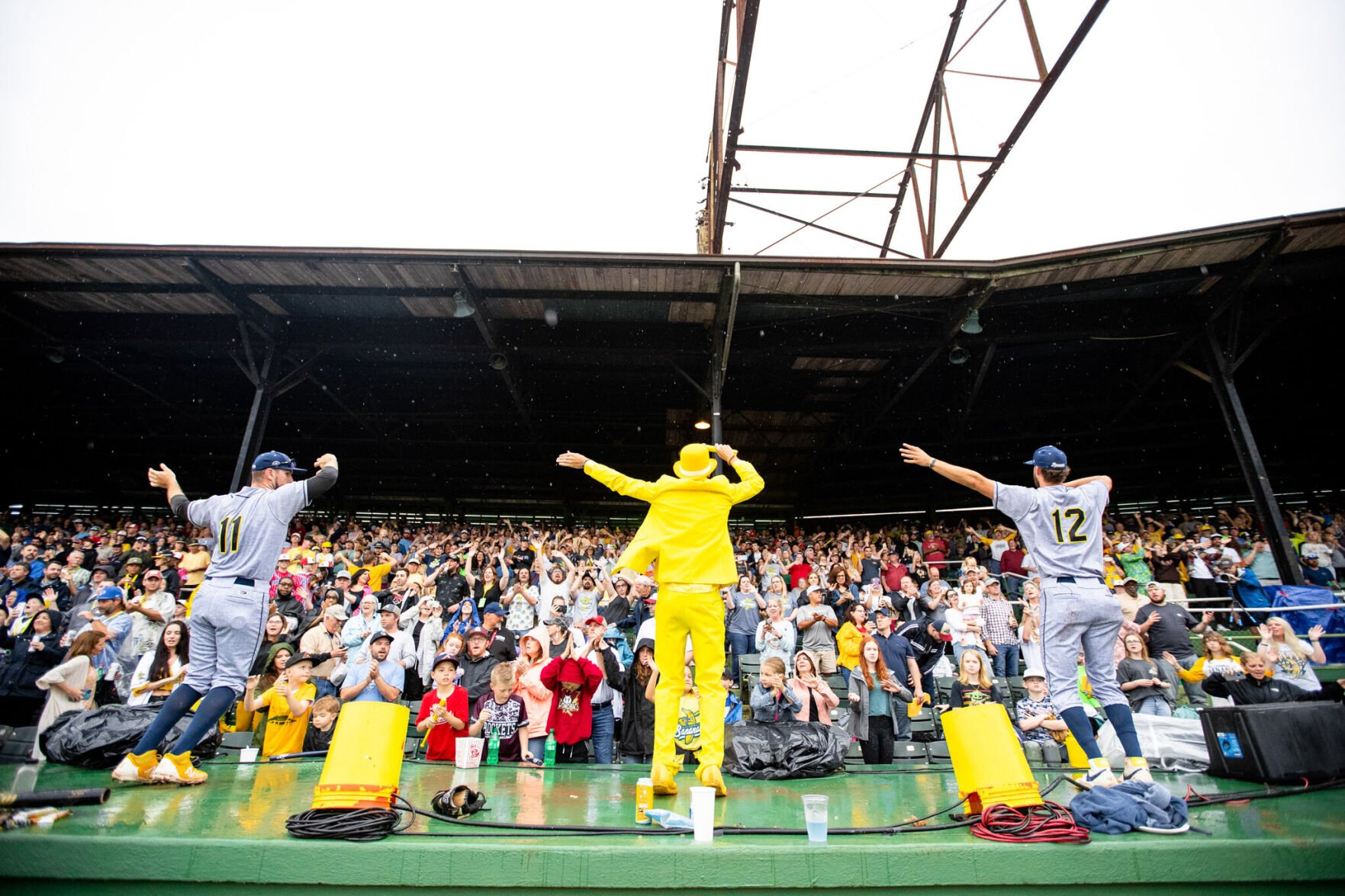 <p>Jesse Cole, center, hypes up the crowd.</p>