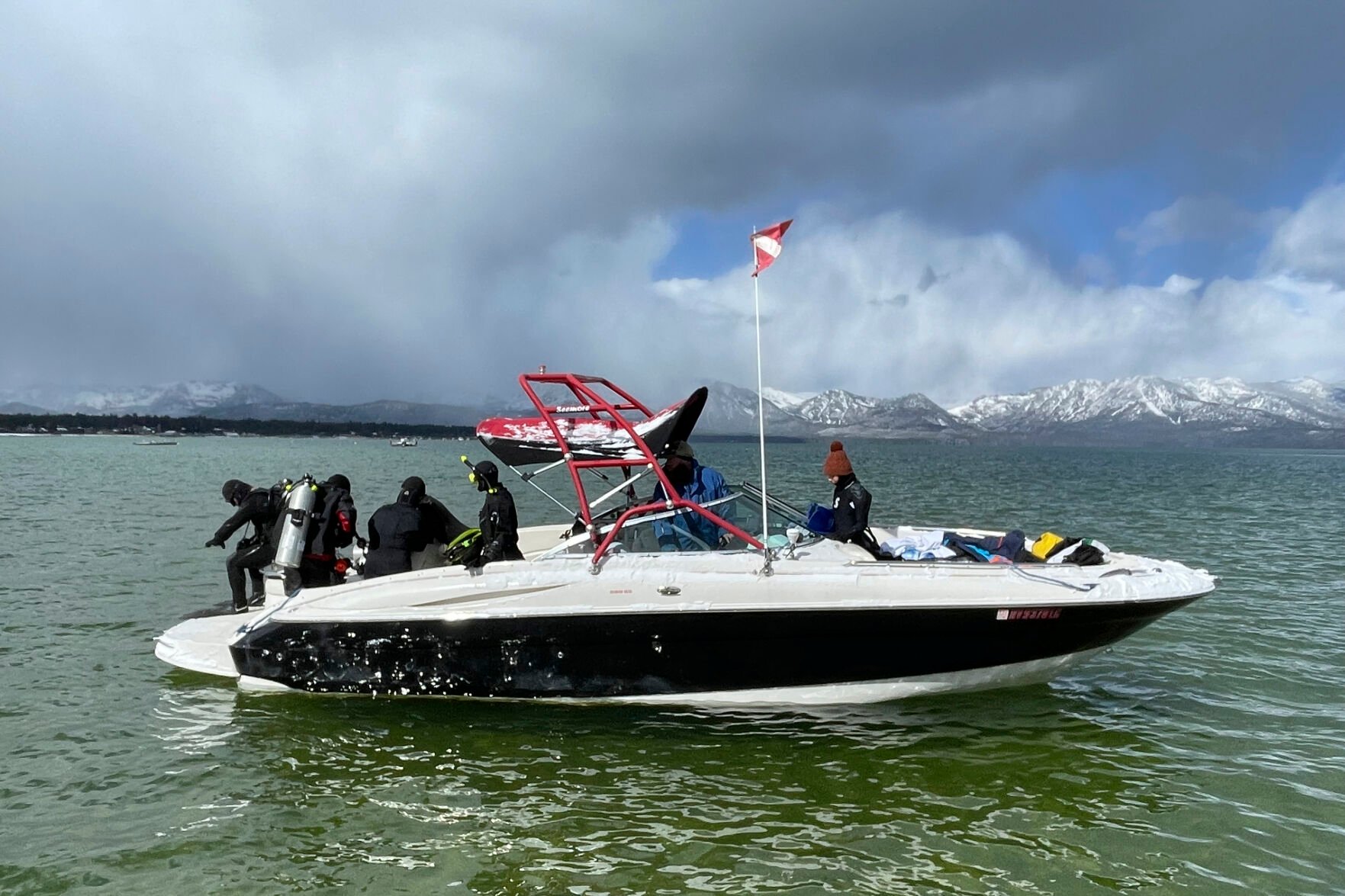 <p>Divers prepare to enter the water at the end of the year-long Lake Tahoe cleanup in Stateline, Nev., Tuesday, May 10, 2022. </p>