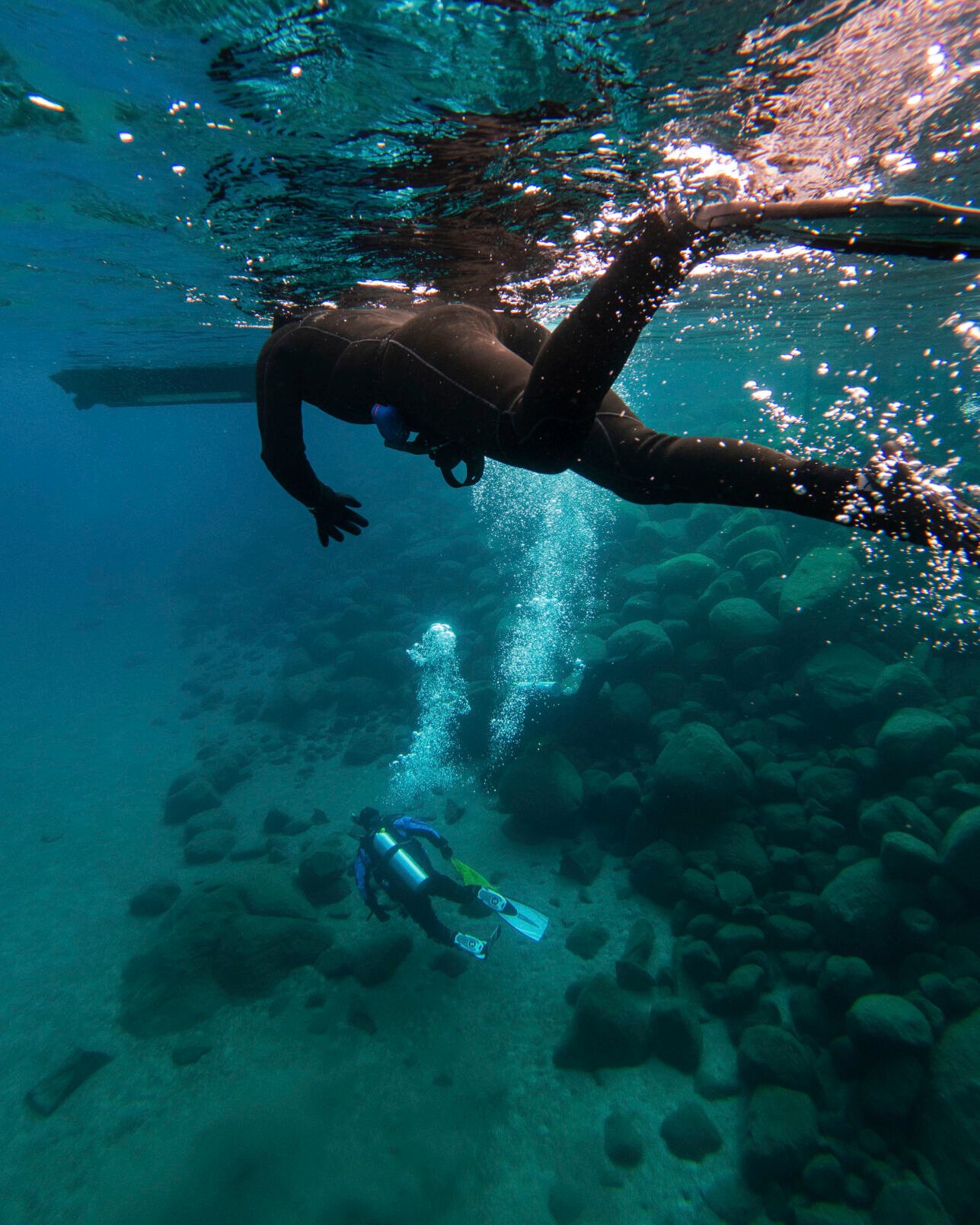 <p>This photo provided by Clean Up The Lake shows scuba divers during the 72 Mile Clean Up during the winter of 2022, in Lake Tahoe, Nev. </p>