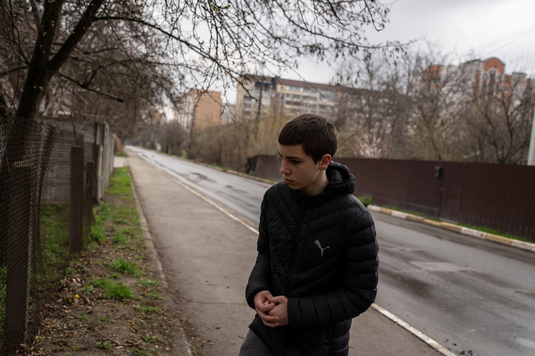 <p>Yura Nechyporenko, 15, stands at the scene were his father was killed, in Bucha, on the outskirts of Kyiv, Ukraine, on Thursday, April 21, 2022. </p>