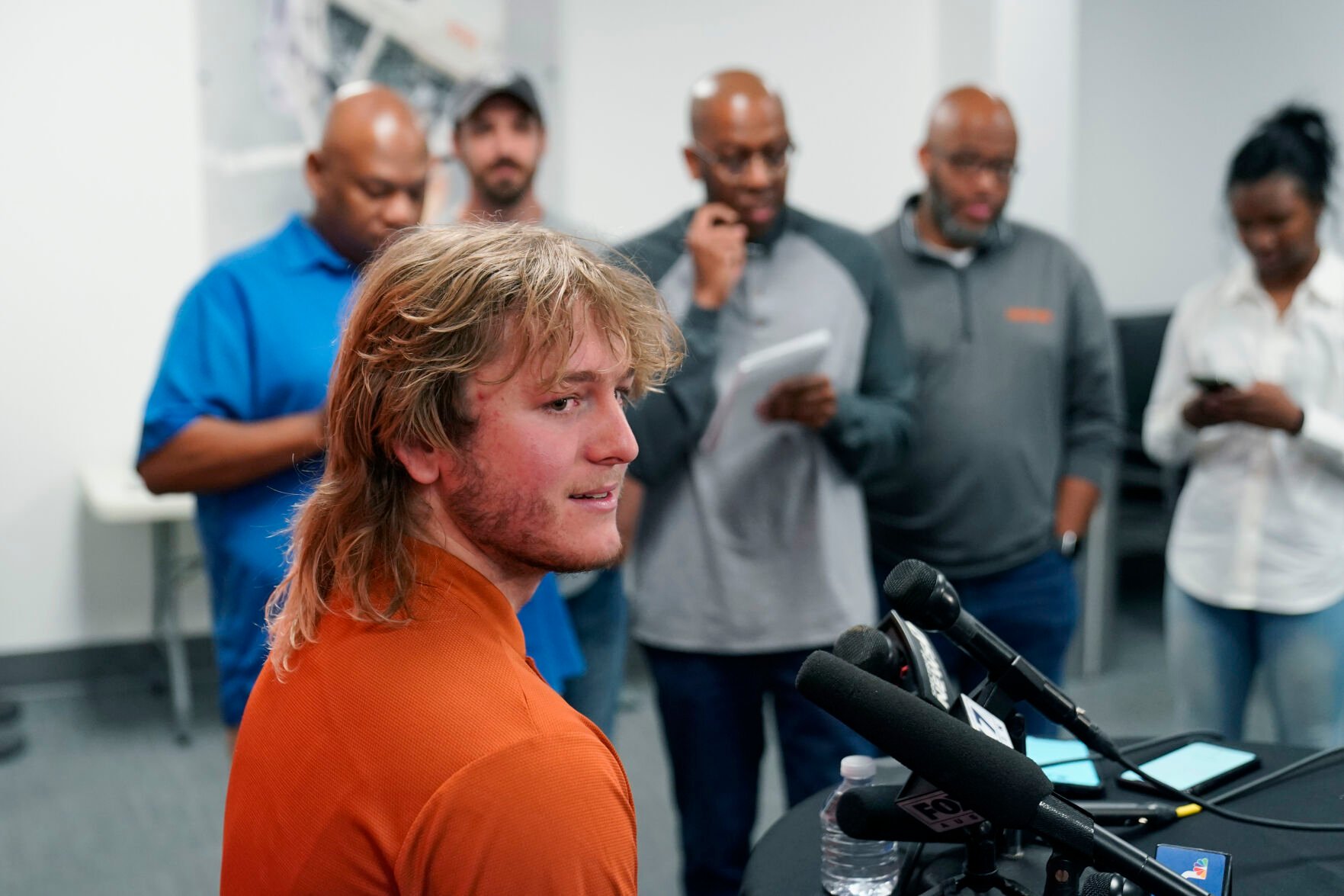 <p>Texas NCAA college football quarterback Quinn Ewers talks to the media following a spring practice, Thursday, April 14, 2022, in Austin, Texas. </p>
