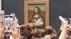 Watch Now: Man Disguised As Old Woman Throws Cake At The Mona Lisa